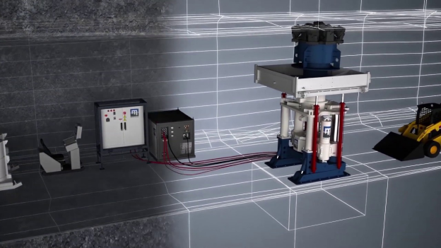 A 3D rendering of an industrial setup shows various machinery. On the left is a control panel with cables connecting to a large, blue and white hydraulic press in the center. To the right, there is a yellow and black mini loader. The background features grid lines.